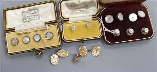 A pair of engraved yellow metal oval cufflinks, a set of three dress studs and three sets of dress studs/buttons